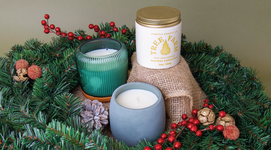 3 Tree Farm scented candles surrounded by christmas wreaths 